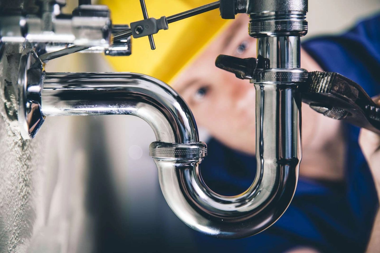 Frozen pipes Sligo – plumber working on a pipe trap