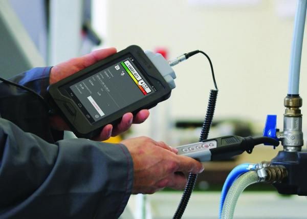Leak detection Sligo – plumber testing pipework with a leak detector